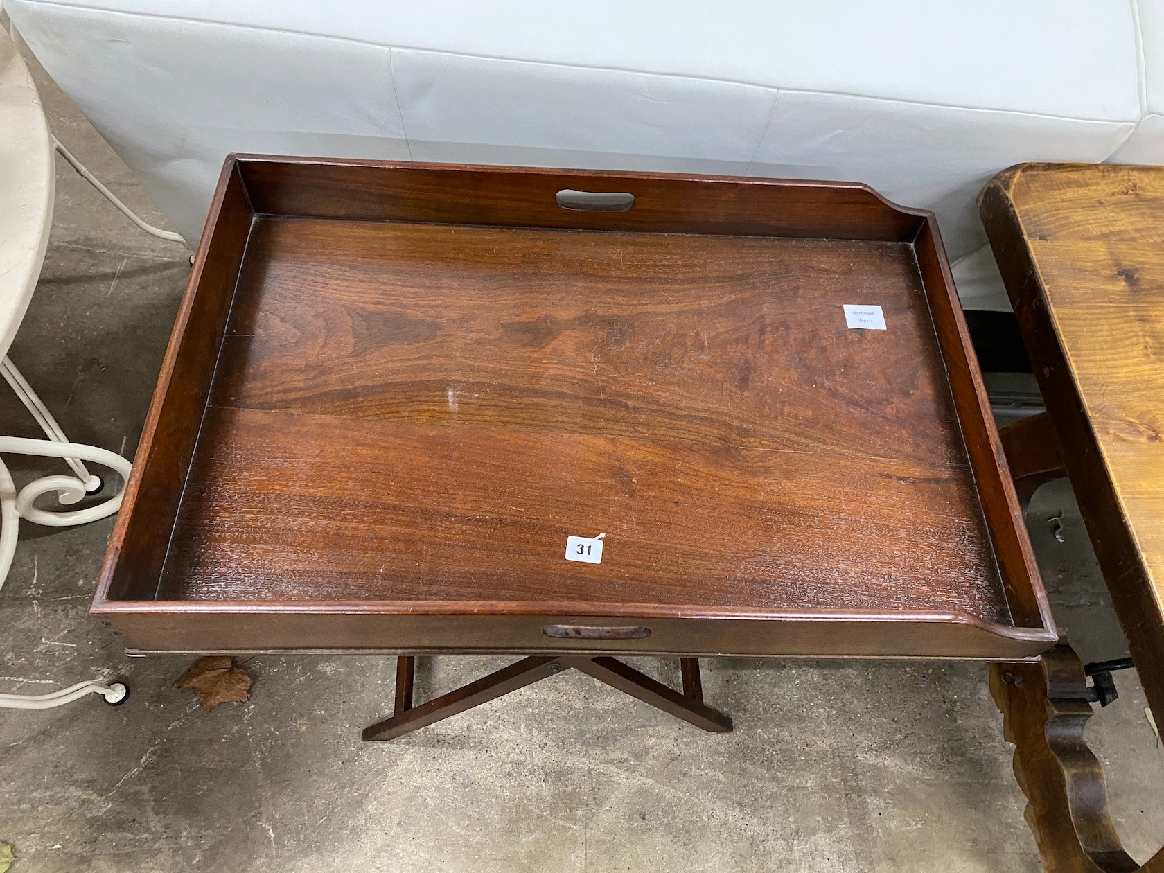 A Victorian style rectangular mahogany butler's tray on folding stand, width 74cm, depth 49cm, height 79cm